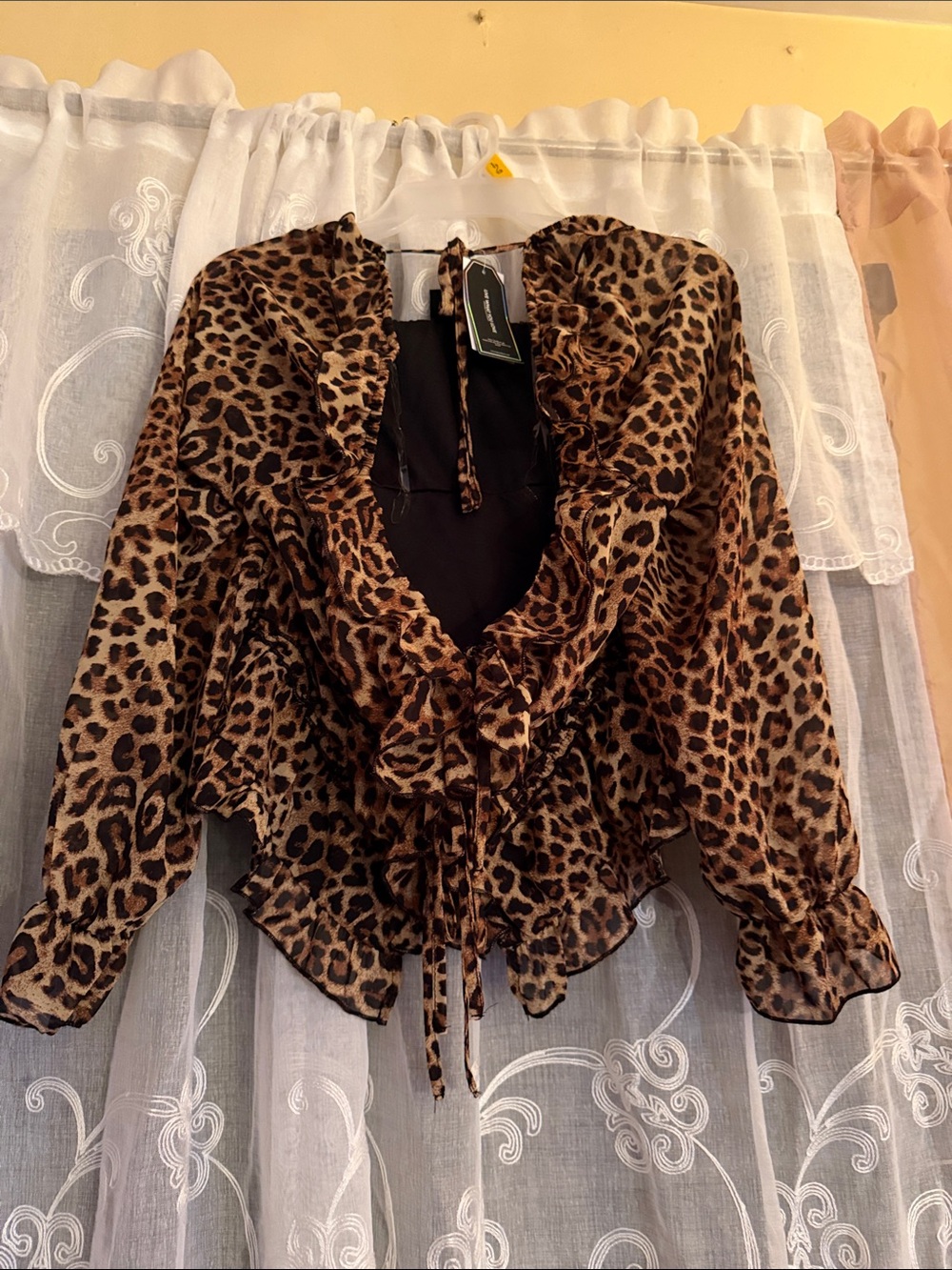 Tinseltown Leopard Print Ruffle V-Neck Blouse - Brown slightly cropped.
